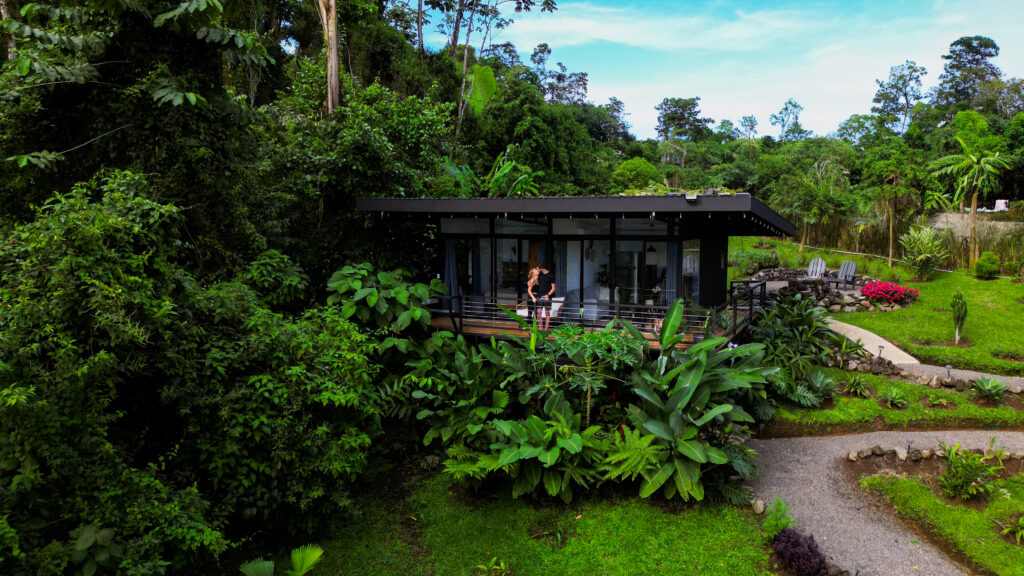 couple surrounded by greenery in costa rica from a drone