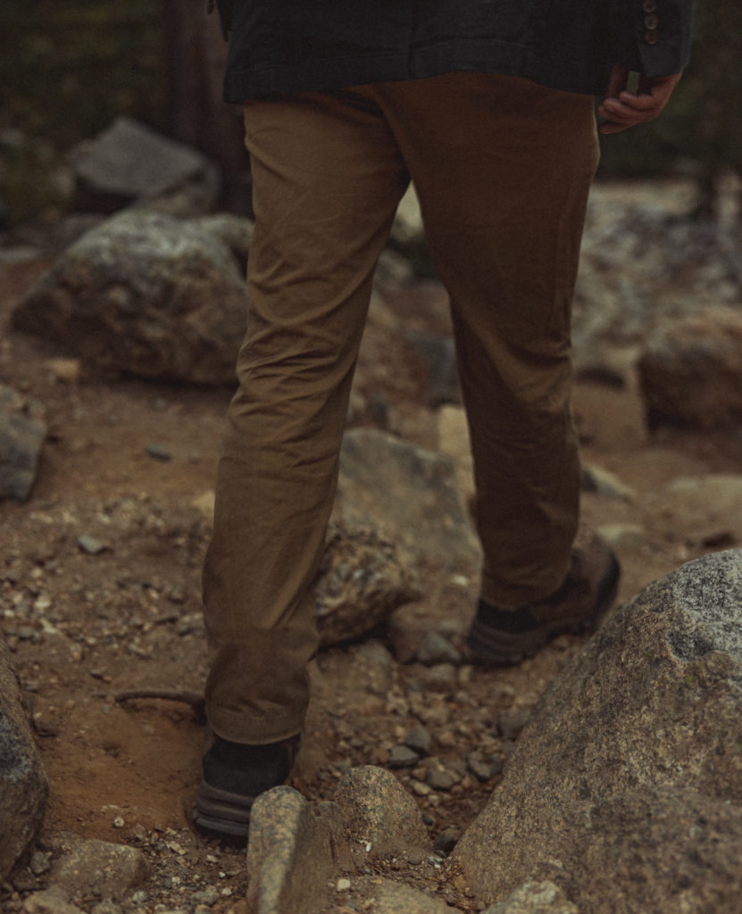 a groom hiking in his hiking shoes for his wedding