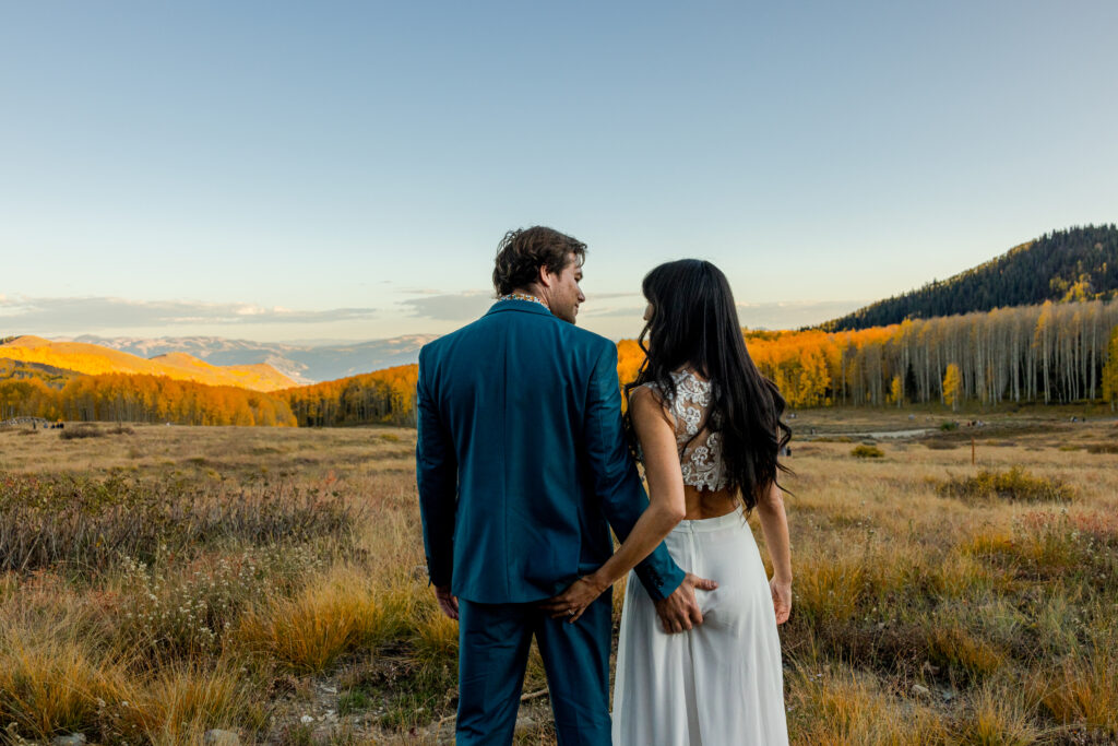 A Guide to eloping in Colorado. A couple grabbing butts while eloping