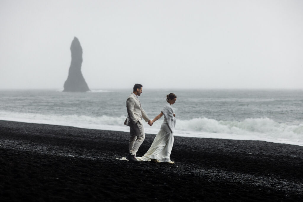 A couple eloping on the black sand beach of Iceland