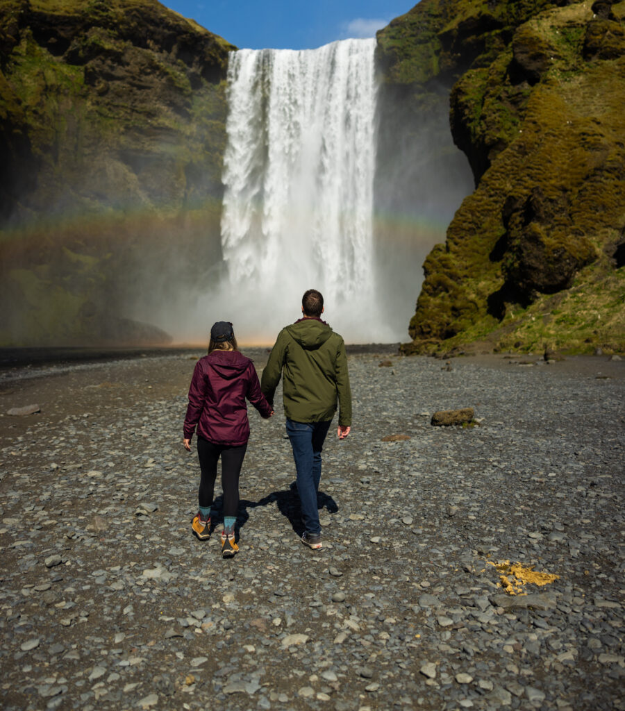 a couple eloping at Skógafoss falls in iceland