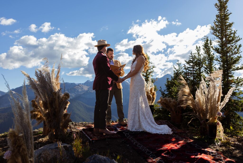 couple getting married on top of a mountain in aspen colorado in the smith cabin