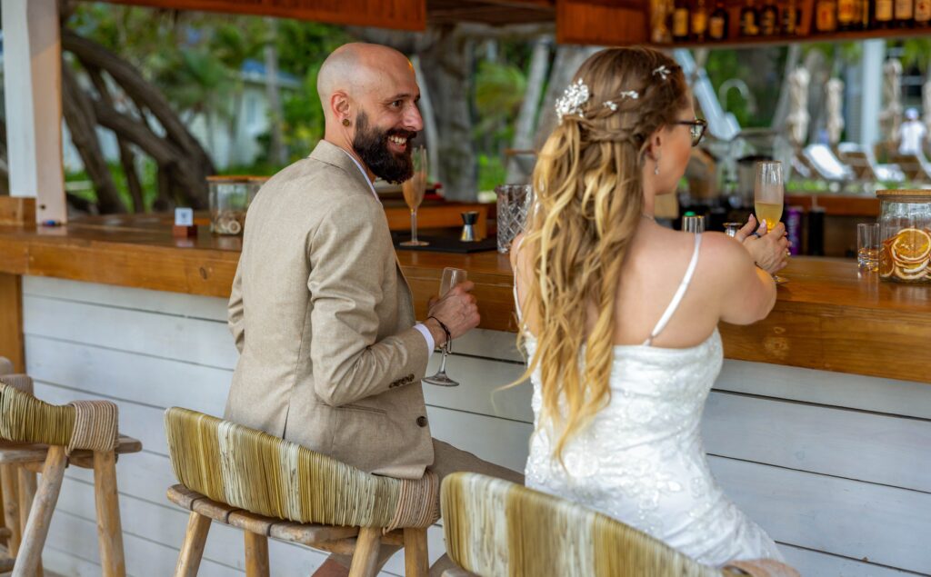 Eloping in a tropical country at an all inclusive. A couple at a bar after getting married in the Dominican Republic