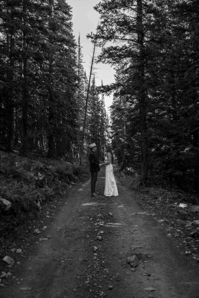 Bride and groom sharing a joyful moment by the bonfire
