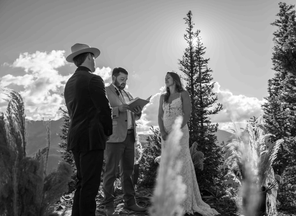 Family and friends watching the intimate mountain ceremony
