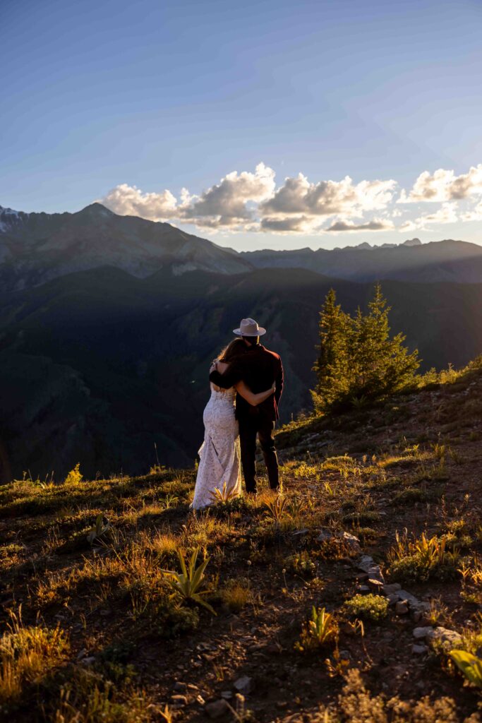 Newlyweds sharing a quiet moment inside their reception tent
