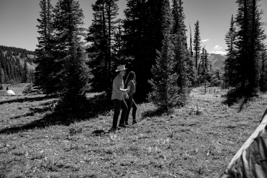 Couple enjoying a first look on a scenic mountain ridge
