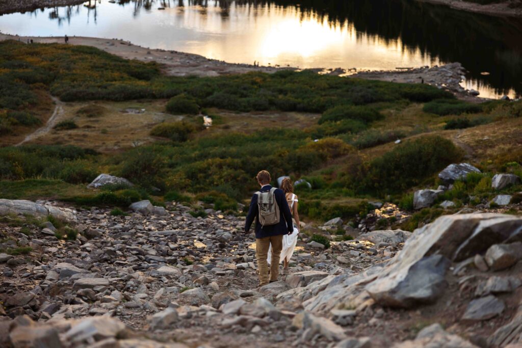 Bride and groom making their way back down the trail, soaking in the moment.