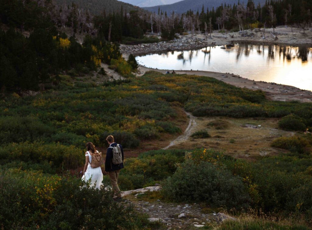 Bride and groom toasting with champagne after their ceremony at St. Mary’s Glacier.