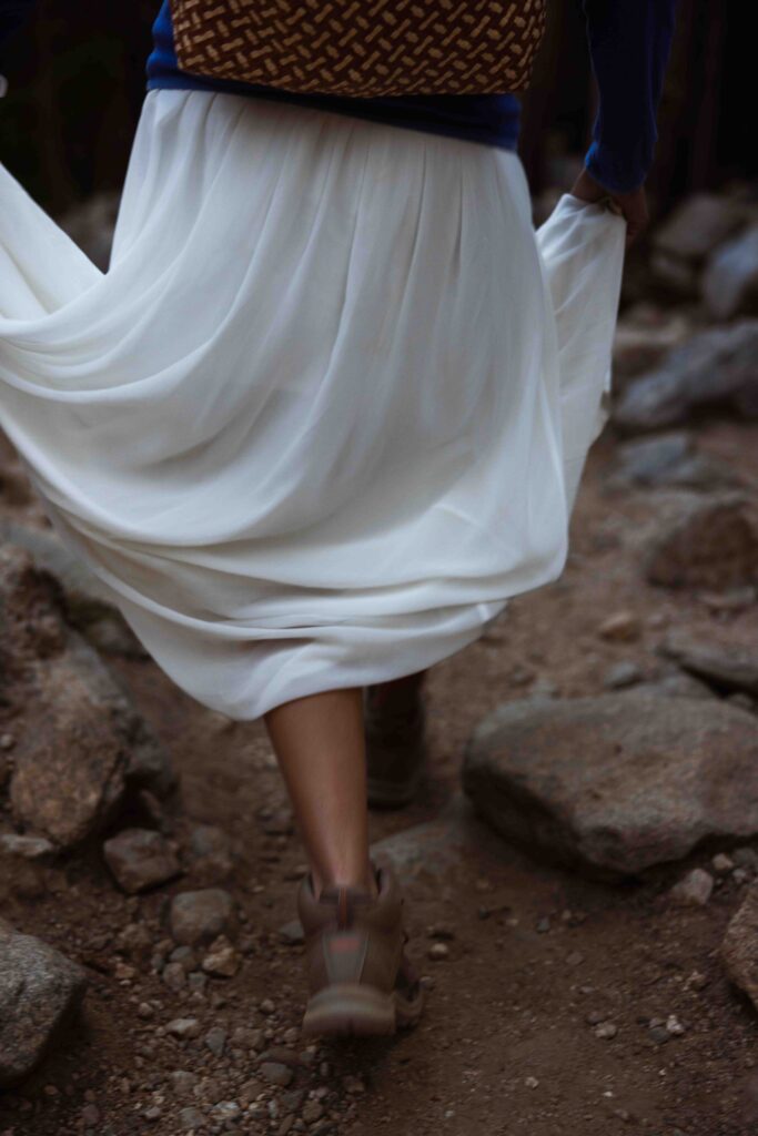 elopement hike with wedding dress on