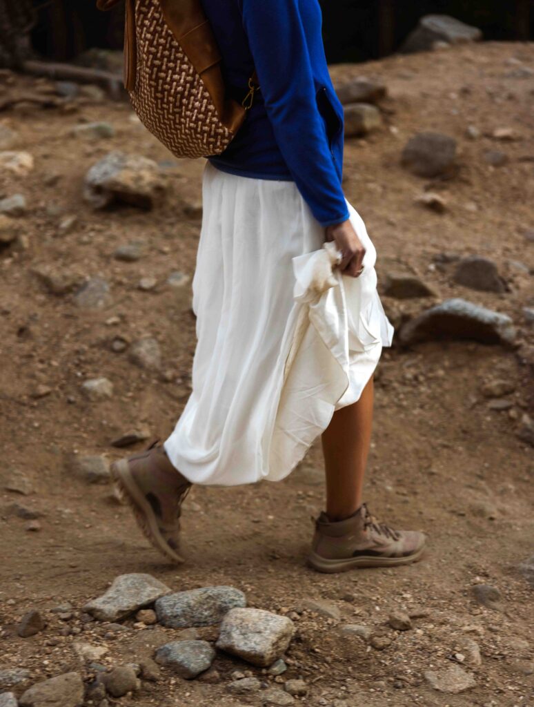 bride hiking in wedding attire