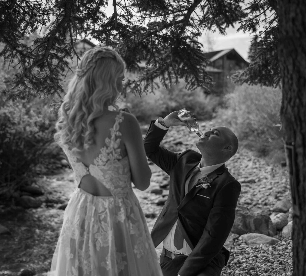 Groom laughing as he gets ‘iced’ during the first look.