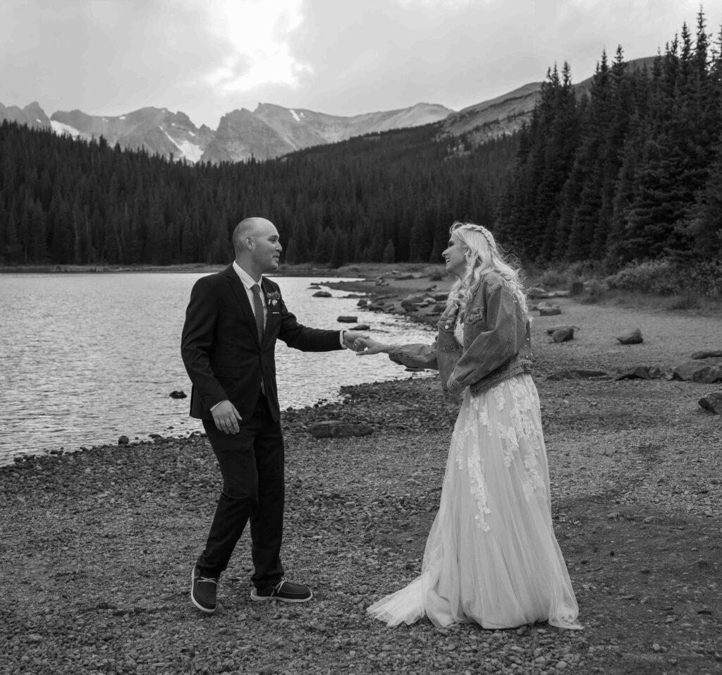 Bride’s dress flowing in the mountain breeze.