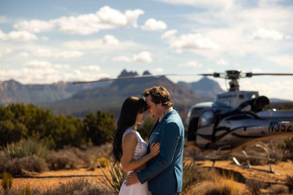 Couple stepping out of their camper in wedding attire