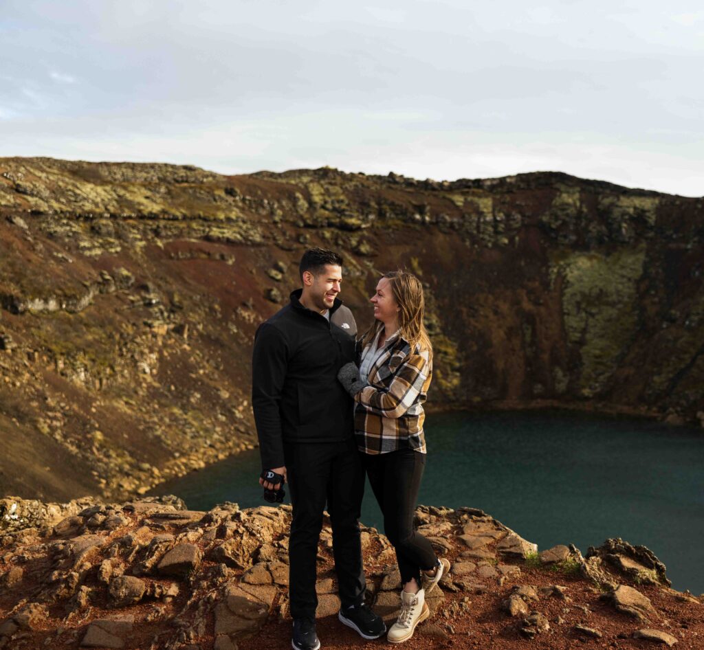 Couple sitting on a boulder, soaking in the view after their elopement