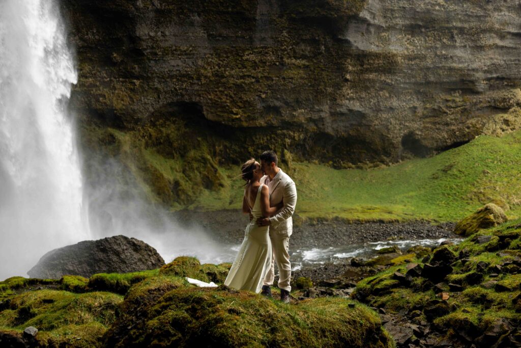 Couple wrapped in a cozy blanket during their Iceland adventure