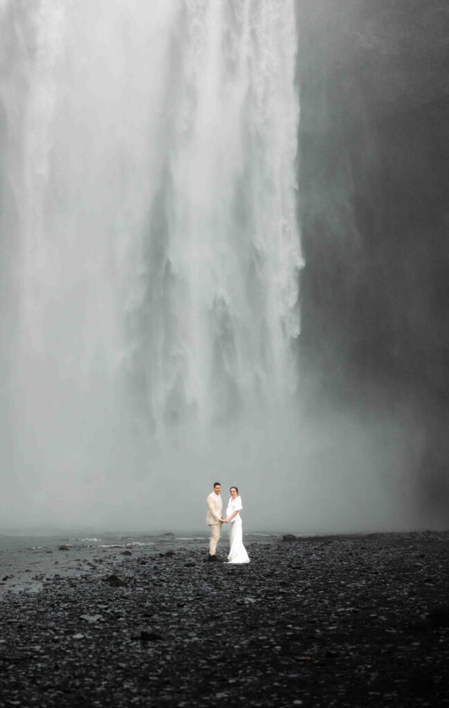 Close-up of the couple’s wedding rings with Icelandic moss as the background