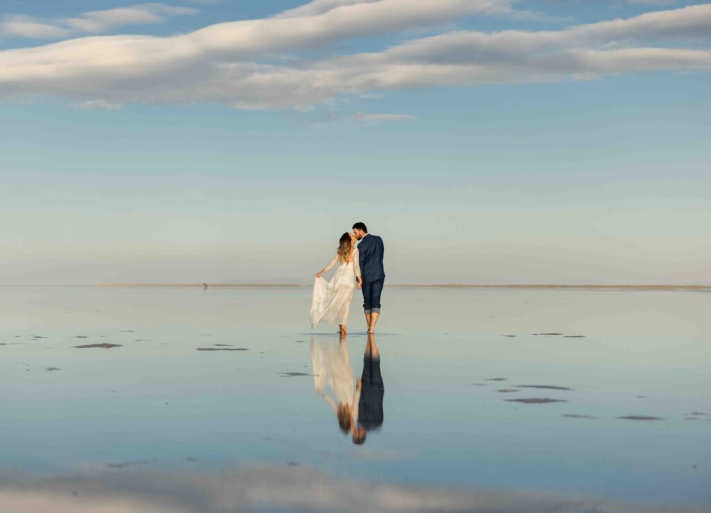 Silhouette of the couple against a colorful sunset sky