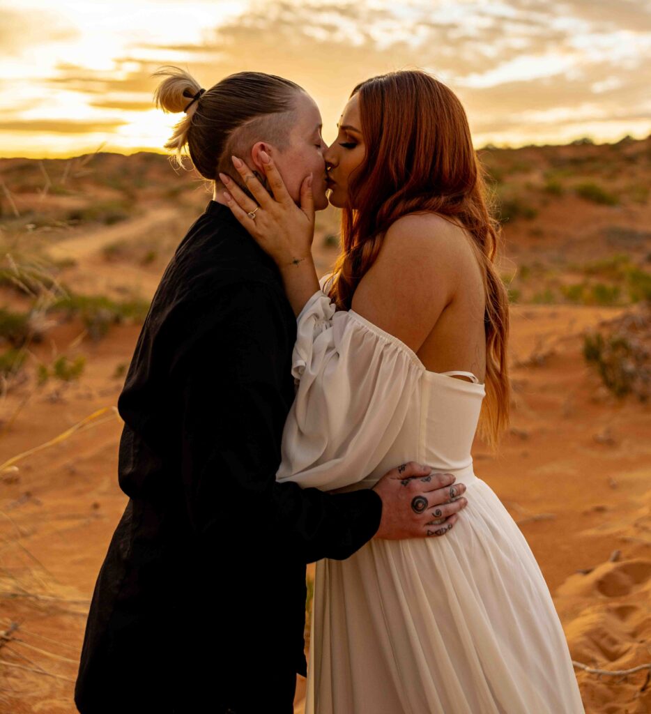 Couples jumping and celebrating with the sun setting behind them