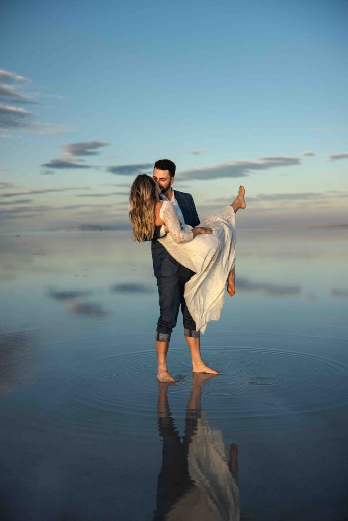 Joyful moment of the couple running hand in hand across the flats