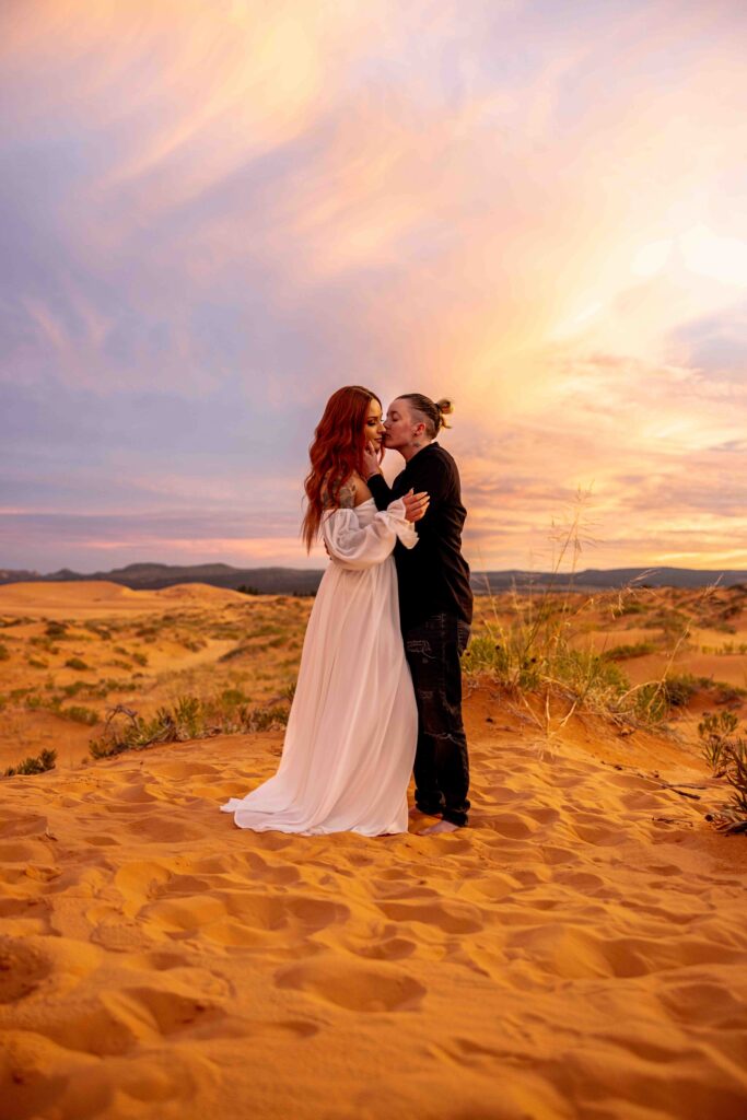 Groom lifting his bride in a playful, candid moment