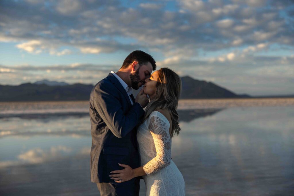 Groom embracing the bride as she rests her head on his chest