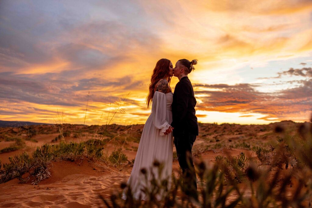 Romantic silhouette of both couples framed by the setting sun