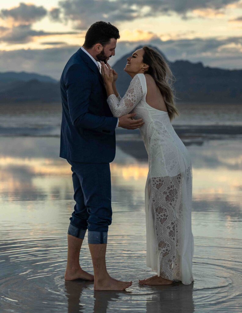 Playful shot of the couple spinning in circles on the flats