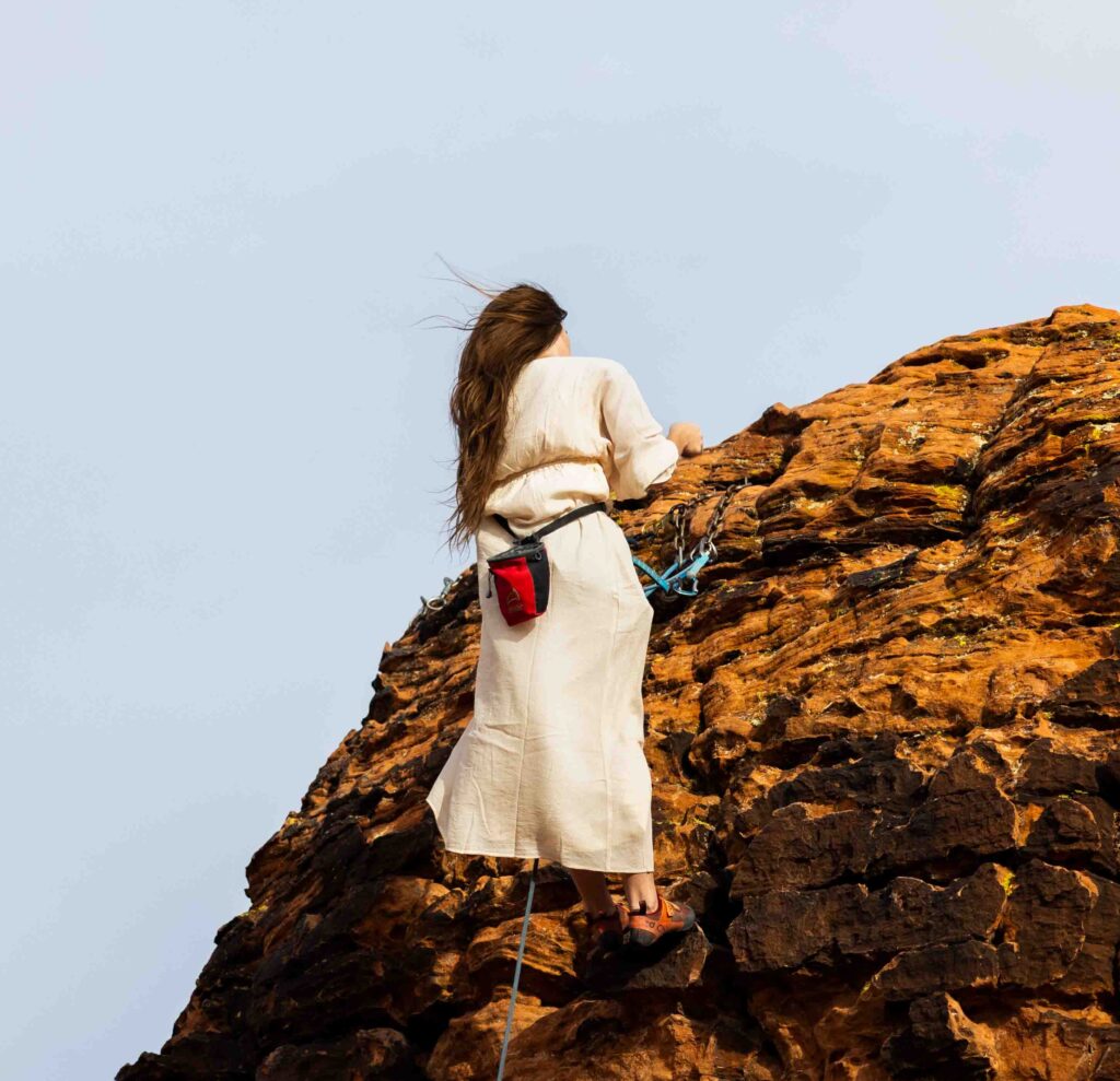 Epic shot of the couple dangling off the cliffside with the breathtaking Utah landscape in the background.
Groom wiping away a tear as the brid