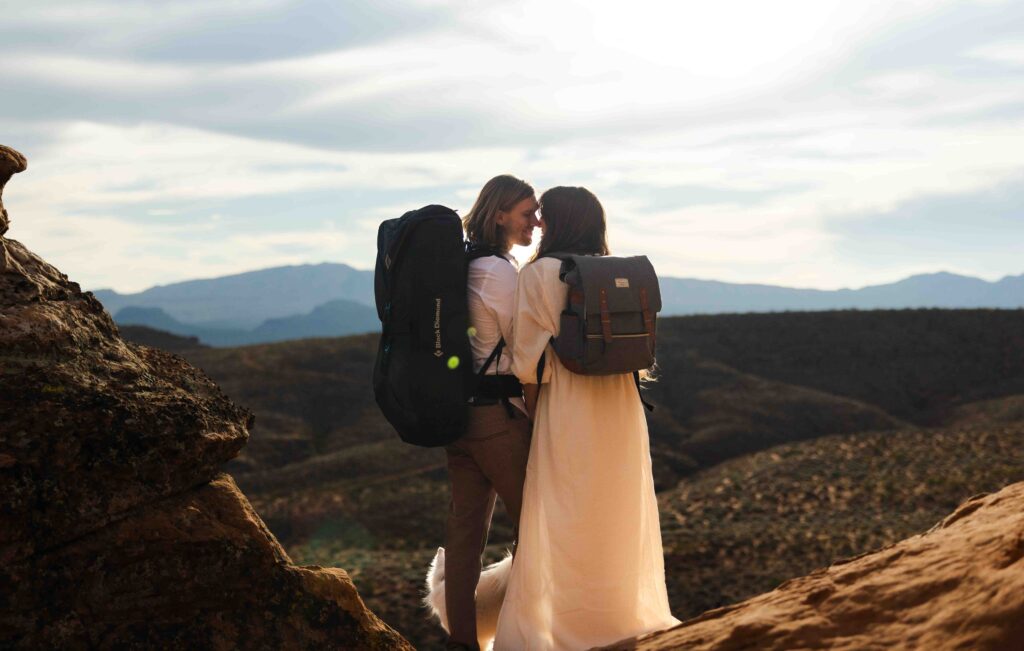 Bride adjusting her helmet and harness before beginning the rock climb.