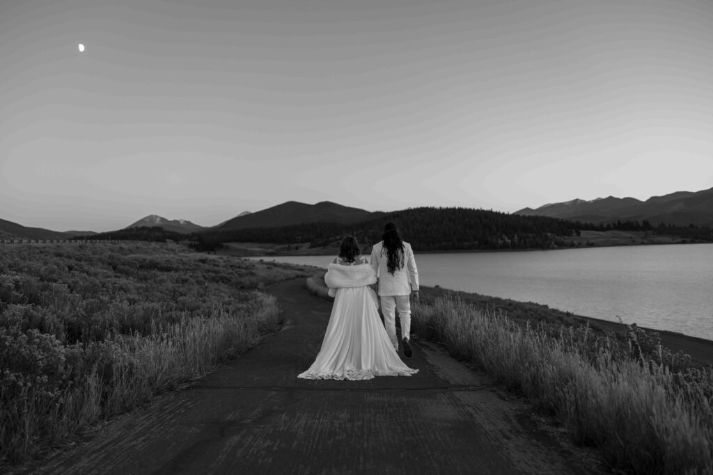 Bride’s veil blowing in the wind with a mountain backdrop.