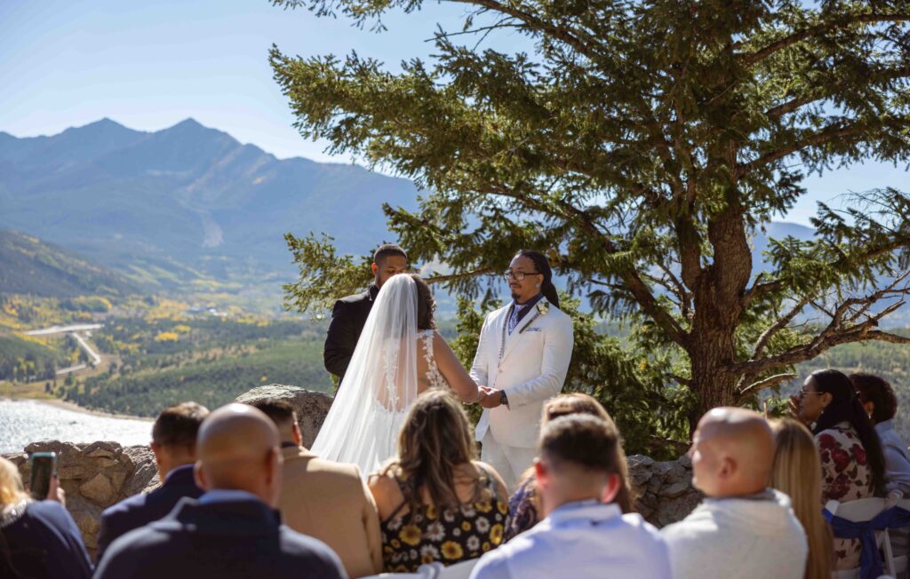 Bride smiling as she walks down the aisle.