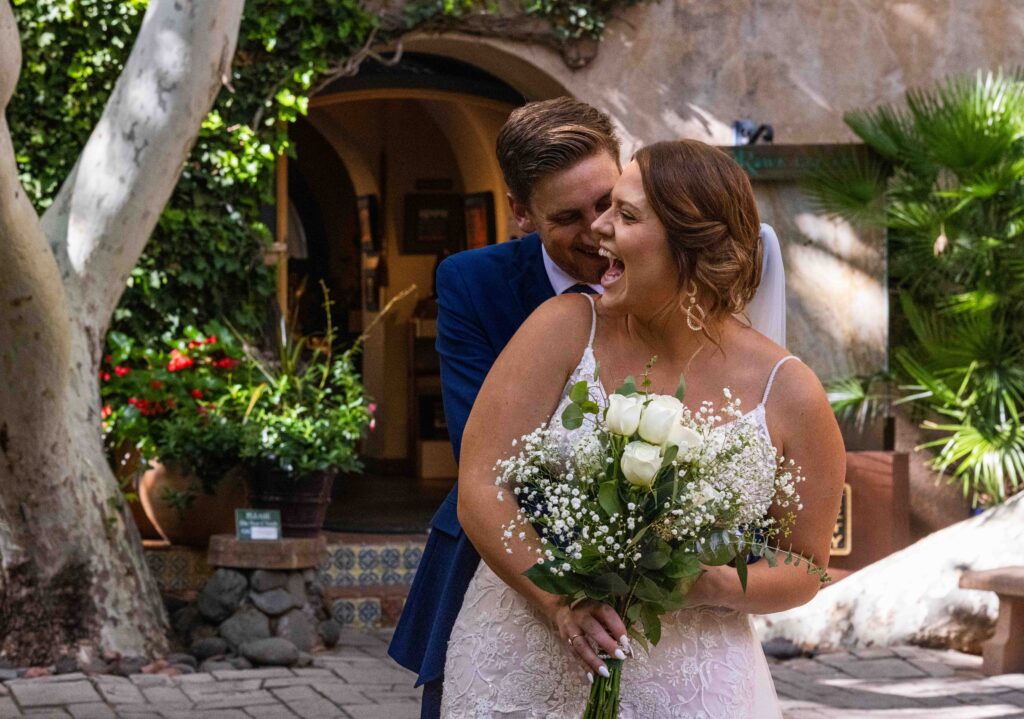 Emotional first look moment as the groom wipes away a tear
