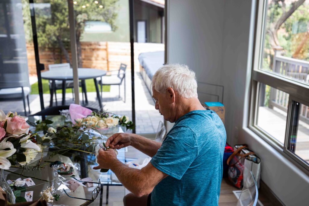 Bride and groom clinking coffee mugs, sharing a quiet moment before the big day
