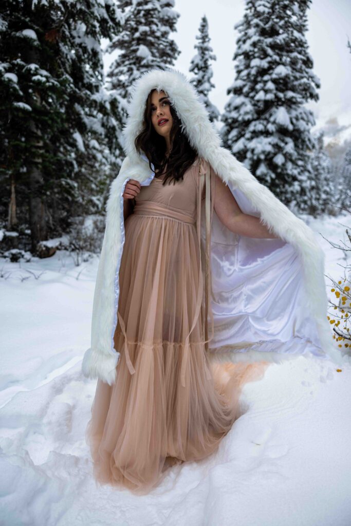 Snow falling softly around the couple as they say their vows