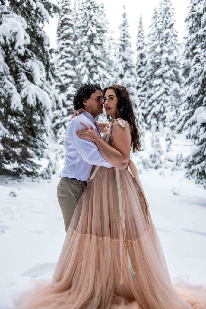 Champagne bottle popping as the couple celebrates their elopement